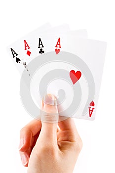 Aces being held over white