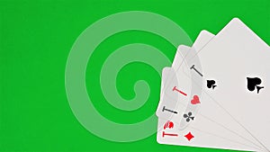 Aces on the green background of the game table.