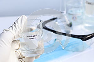 acetic acid in glass, chemical in the laboratory and industry
