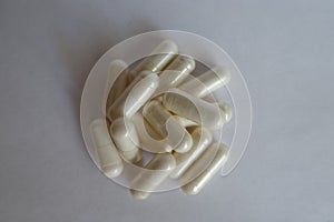 Acetyl L-Carnitine capsules on neutral background