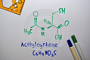 Acetylcysteine write on the white board. Structural chemical formula. Education concept