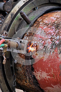 Acetylene torch and iron pipe