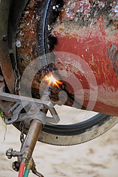 Acetylene torch and iron pipe