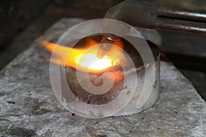 Acetylene torch smelting hot precious metals down