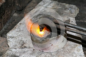 Acetylene torch smelting hot precious metals down