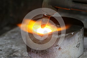 Acetylene torch smelting hot precious metals down