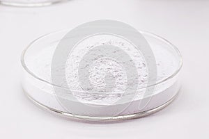 Acetylsalicylic acid powder being produced in the laboratory, inside a petri dish, medicine obtained from salicylic acid and