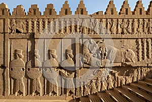 Achaemenid Bas Relief Carvings of Lion and Bull Combat Beside Soldiers in Persepolis