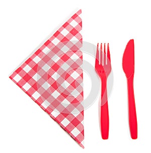 Acheckered napkin with plastic cutlery