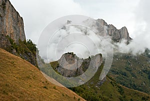 Acheshbok mountain covered by clouds in Autumn, Adygeya, Russia photo