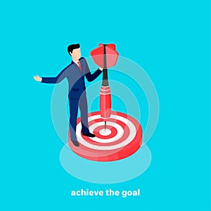 Achieve the goal, man in a business suit with a dart in his hand