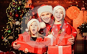 Achieve impeccable christmas day. Little girls with lot gift boxes. Christmas morning routine for moms. Mom hug