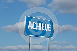 Achieve sign against sky