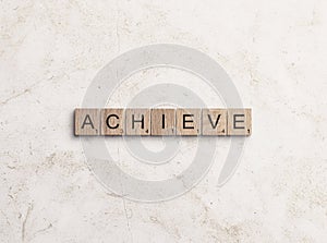 Achieve word written on wooden cubes background. Creative text concept. Copy space for text