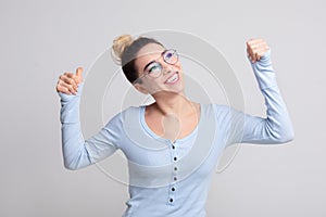 Achievement concept. Woman raised fists, celebrating success