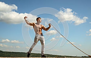 Achieving ambition in sport. Strong man pull rope. Sport man develop muscular hand strength. Athlete with fit torso