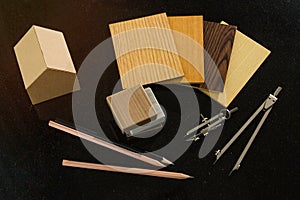 achitect samply materials for home design and construction concept with copy space. pencils and protracters, house and wood photo
