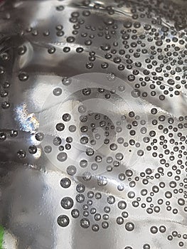 Achromatic monochrome bubbles on a transparent wall