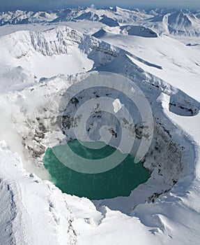 Acid lake in the crater of a volcano