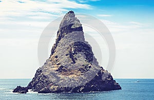 Acitrezza rocks of the Cyclops, sea stack Faraglione Grande in Catania, Sicily