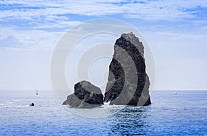 Acitrezza rocks of the Cyclops, sea stacks in Catania, Sicily, Italy