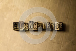 ACKNOWLEDGE - close-up of grungy vintage typeset word on metal backdrop