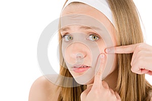 Acne facial care teenager woman squeezing pimple photo