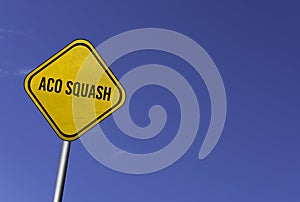 Aco squash - yellow sign with blue sky background photo