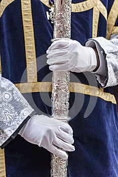 Acolyte with processional candlestick