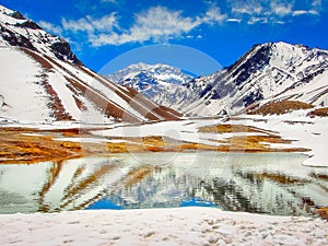 Aconcagua and lake reflection at dramatic sky, Andes, South America