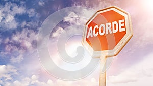 Acorde, Portuguese text for Wake up text on red traffic sign photo