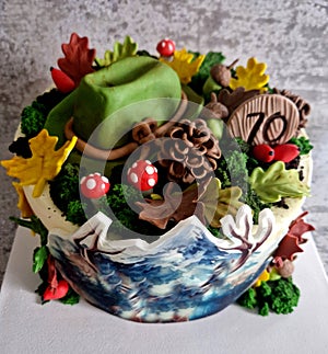 acorns, marshmallows and candied autumn leaves sit on top of a
