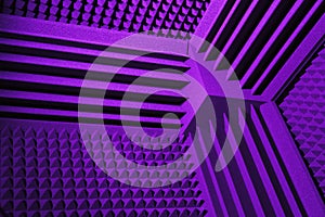 Acoustic foam absorber and bass traps for sound dampering, purple background