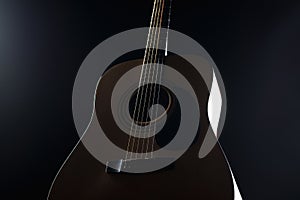 Acoustic guitar on a black background