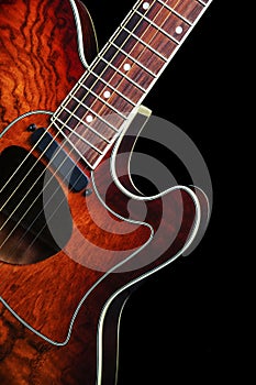 Acoustic guitar on black background