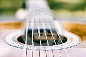 Acoustic guitar bridge and strings close up - macro