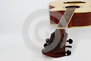 Acoustic guitar brown on white background. Love and music concept