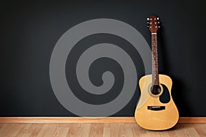 Acoustic guitar in empty room
