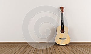 Acoustic guitar in a empty room