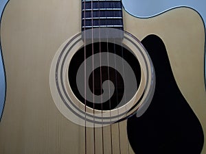 Acoustic guitar front view strings and fretboard