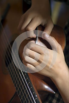 Acoustic guitar and girl's's hands