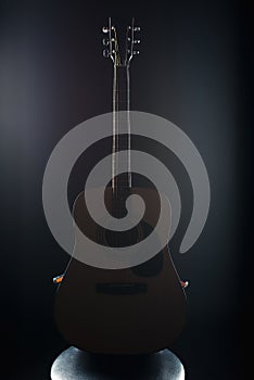 Acoustic guitar on isolated black background