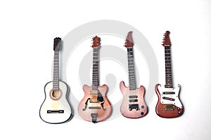 Acoustic guitar, jazz guitar, electric guitar and acoustic bass isolated on white background