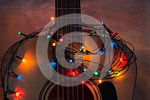Acoustic guitar with lighted garland