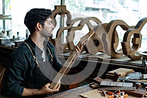 Acoustic Guitar Luthier Inspecting Guitar Neck Bend or Straight