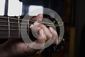 Acoustic Guitar Player Performing. Guitarist Playing In Music Studio