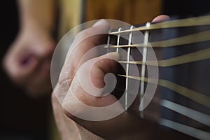 Acoustic Guitar Player Performing. Guitarist Playing In Music Studio photo