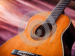 Acoustic guitar on a purple background.
