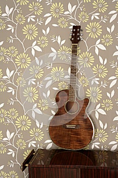 Acoustic guitar retro on vintage 60s wallpaper