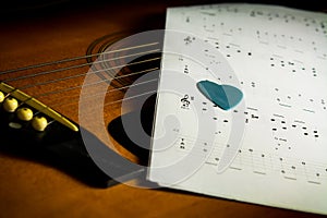 Acoustic guitar with song note